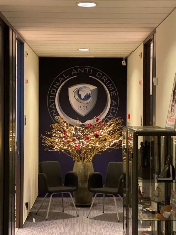 Reception area with the IACA emblem and seating